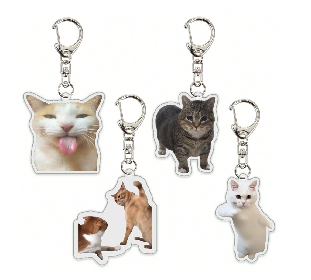 Set of cat-shaped keychains with different cat breeds on a white background
